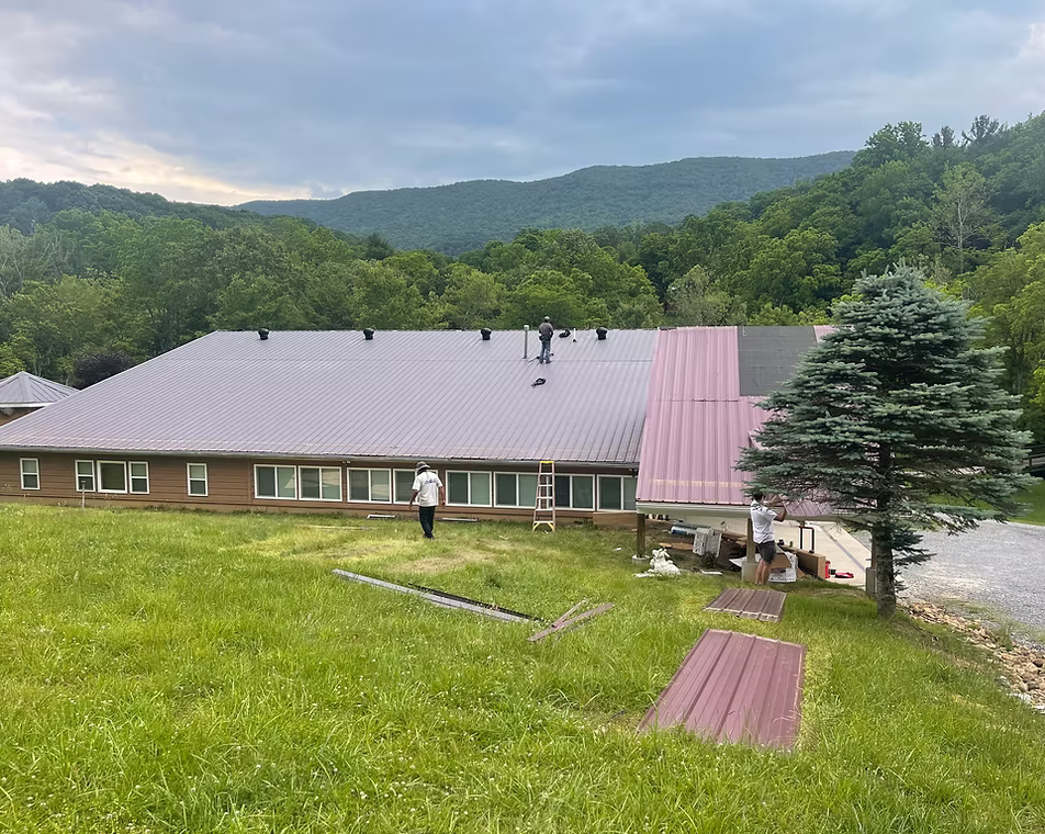 Large metal roof with mountain view