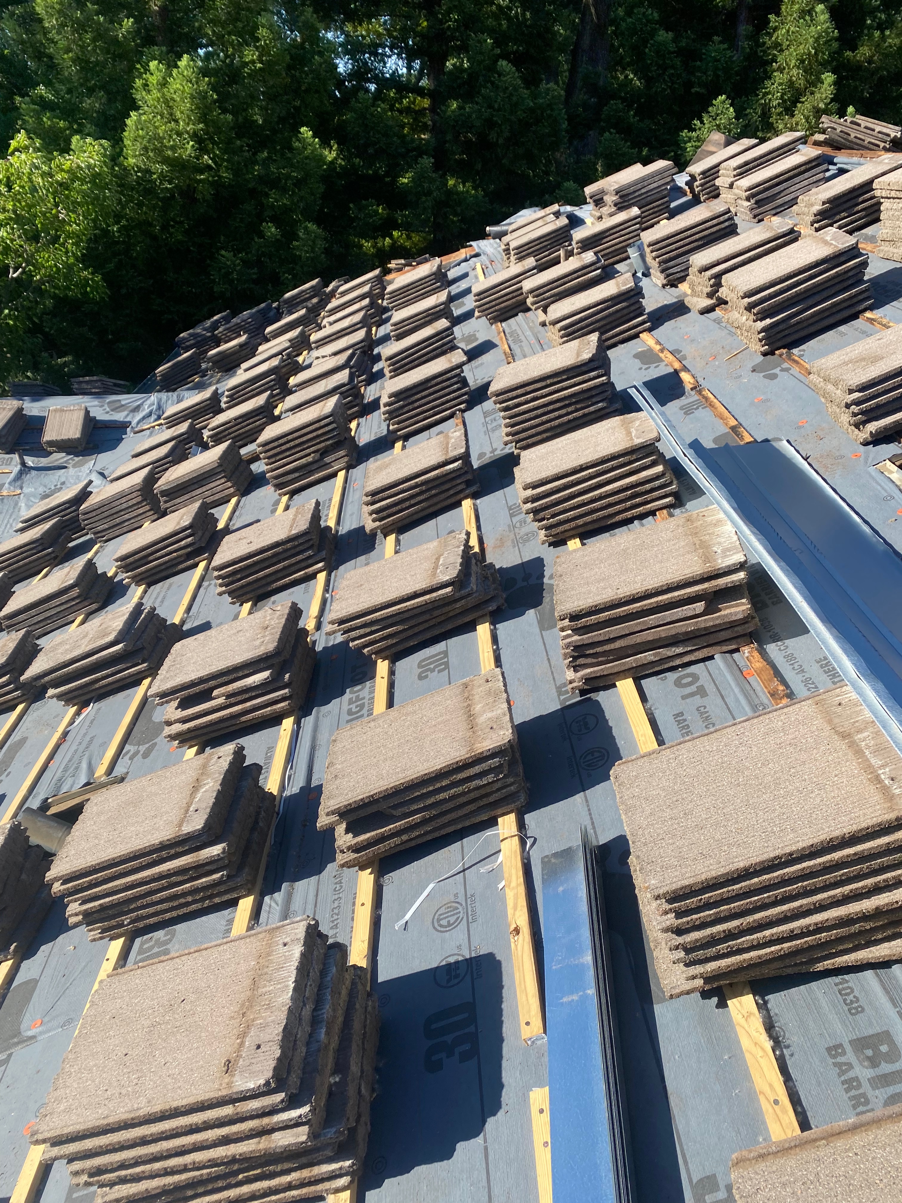Shingles staged on roof deck